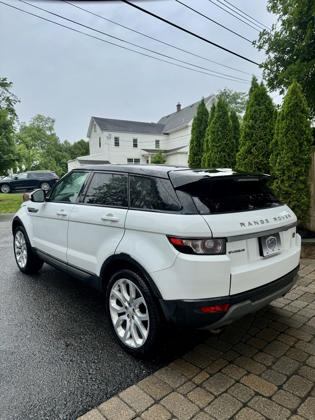 White Range Rover Evoque rear three-quarter view after detailing