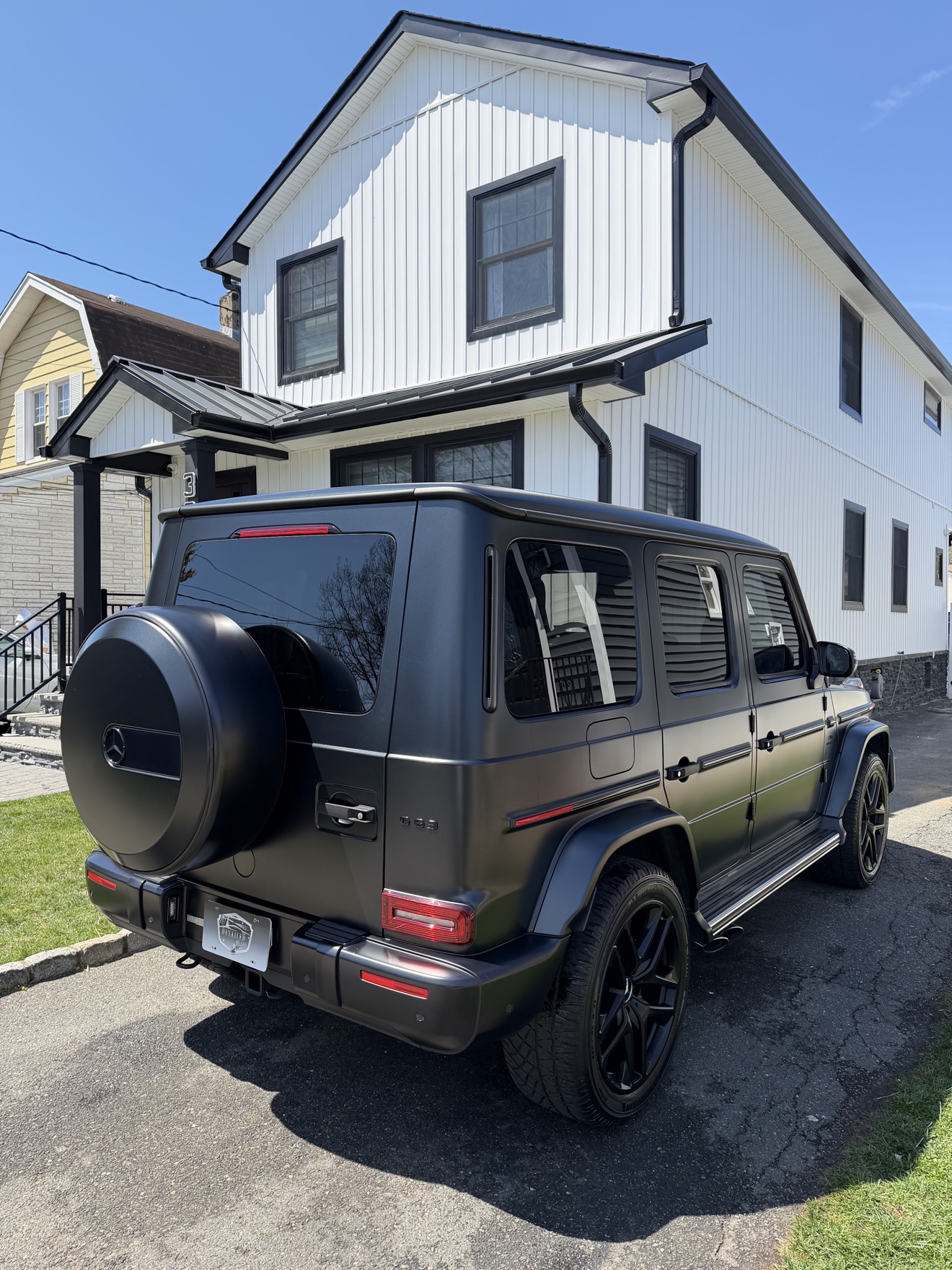 Matte black Mercedes-AMG G 63 rear three-quarter view after detailing