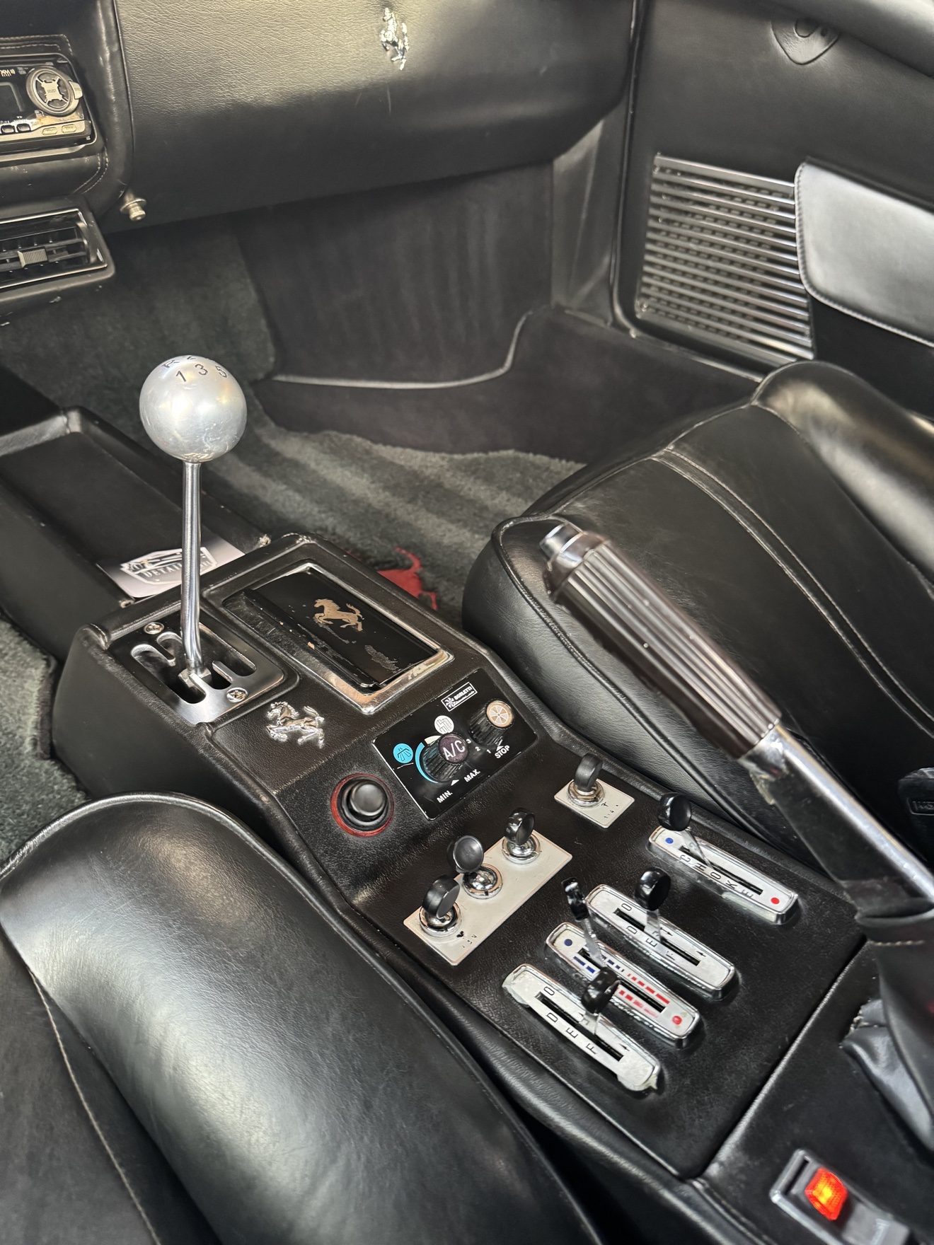 Close-up of the gated shifter in a Ferrari 308 GTS