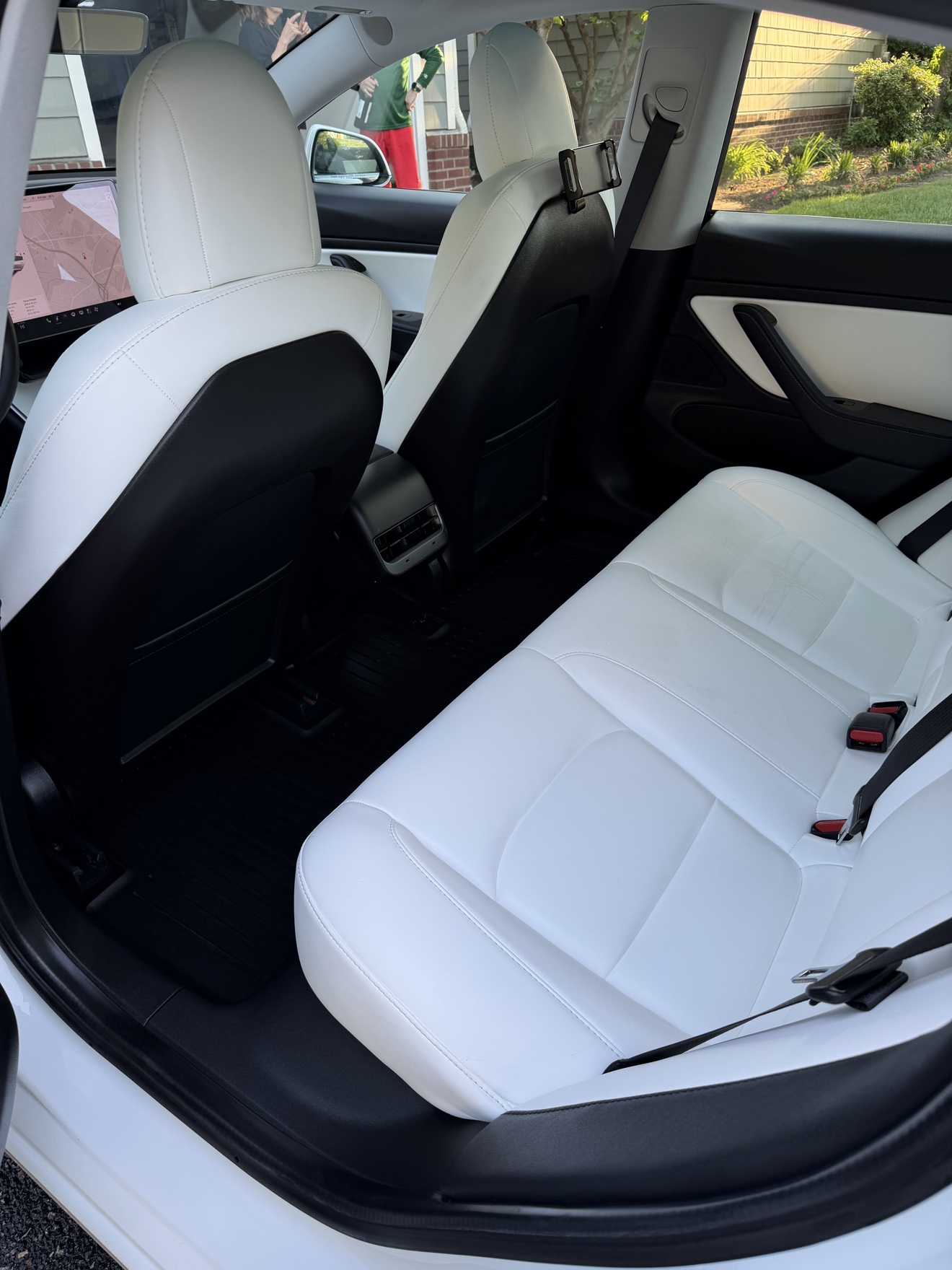 Tesla Model 3 rear seats in white leather after detailing