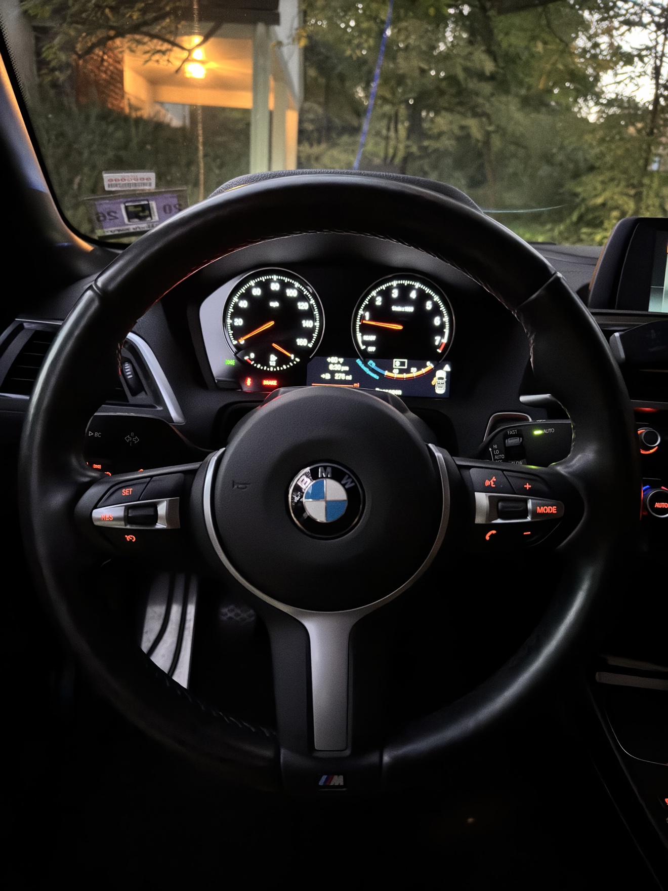 Close-up of the steering wheel and gauges in a BMW M240i