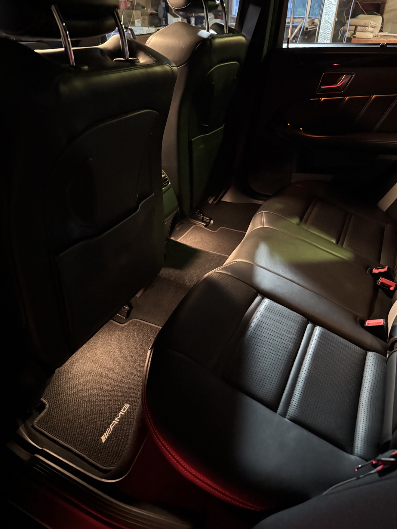 Mercedes Benz E63 S AMG rear seats in black leather with AMG floor mats