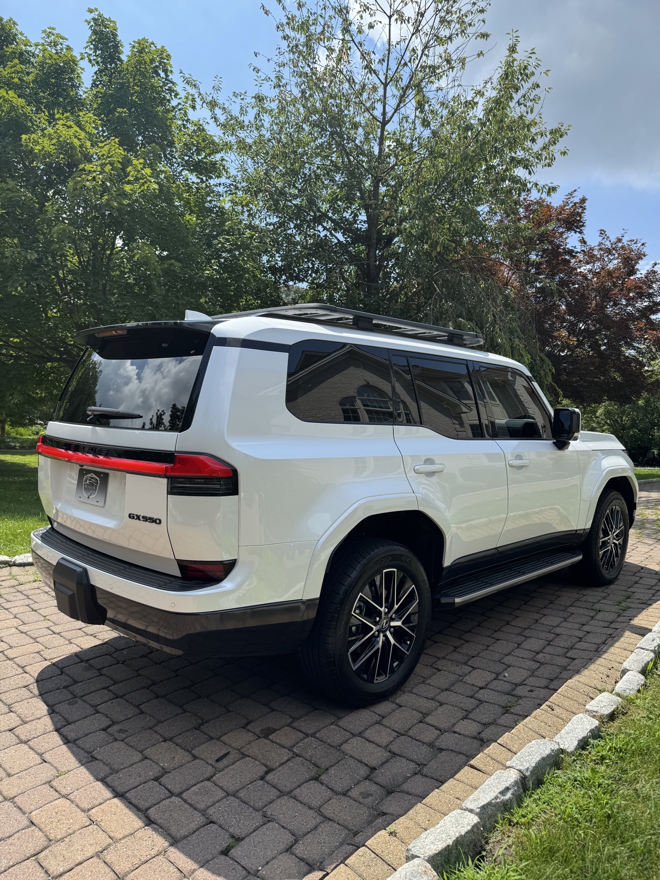 White Lexus GX550 rear three-quarter view with GX550 badge