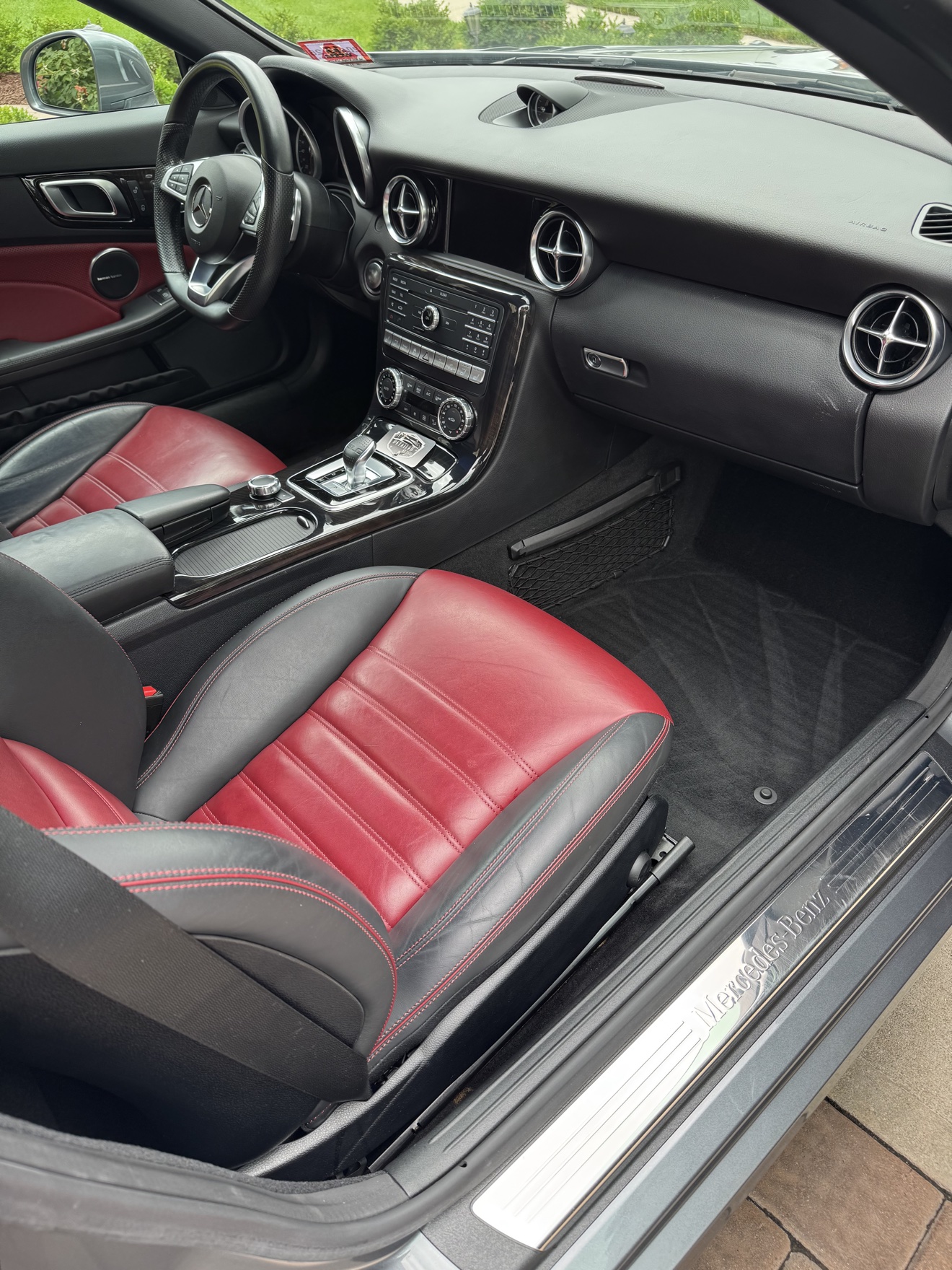 Mercedes-Benz SLC 300 passenger side cockpit with red and black leather seats