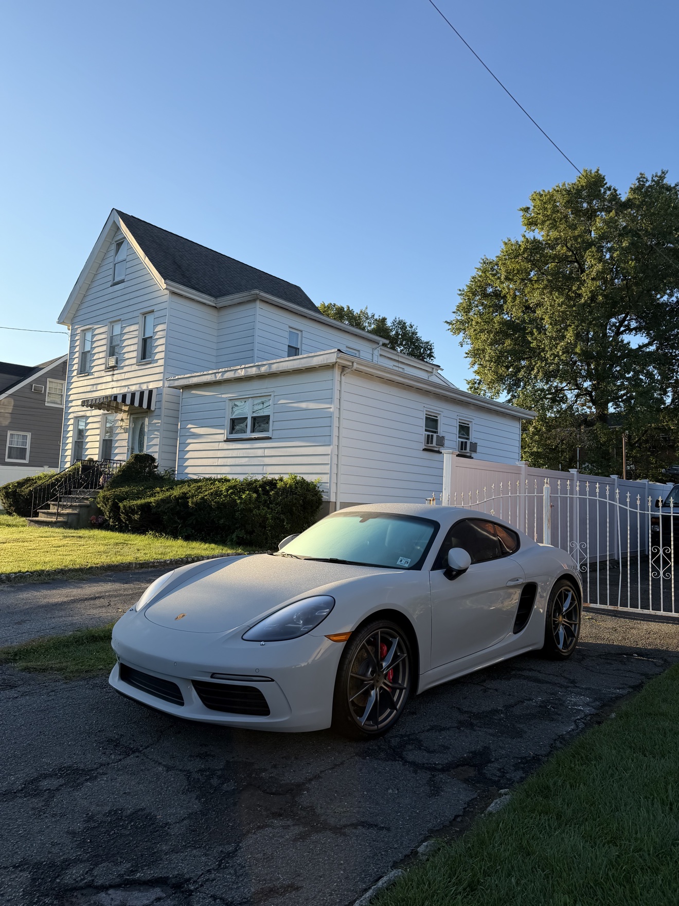 White Porsche 718 Cayman S front three-quarter view