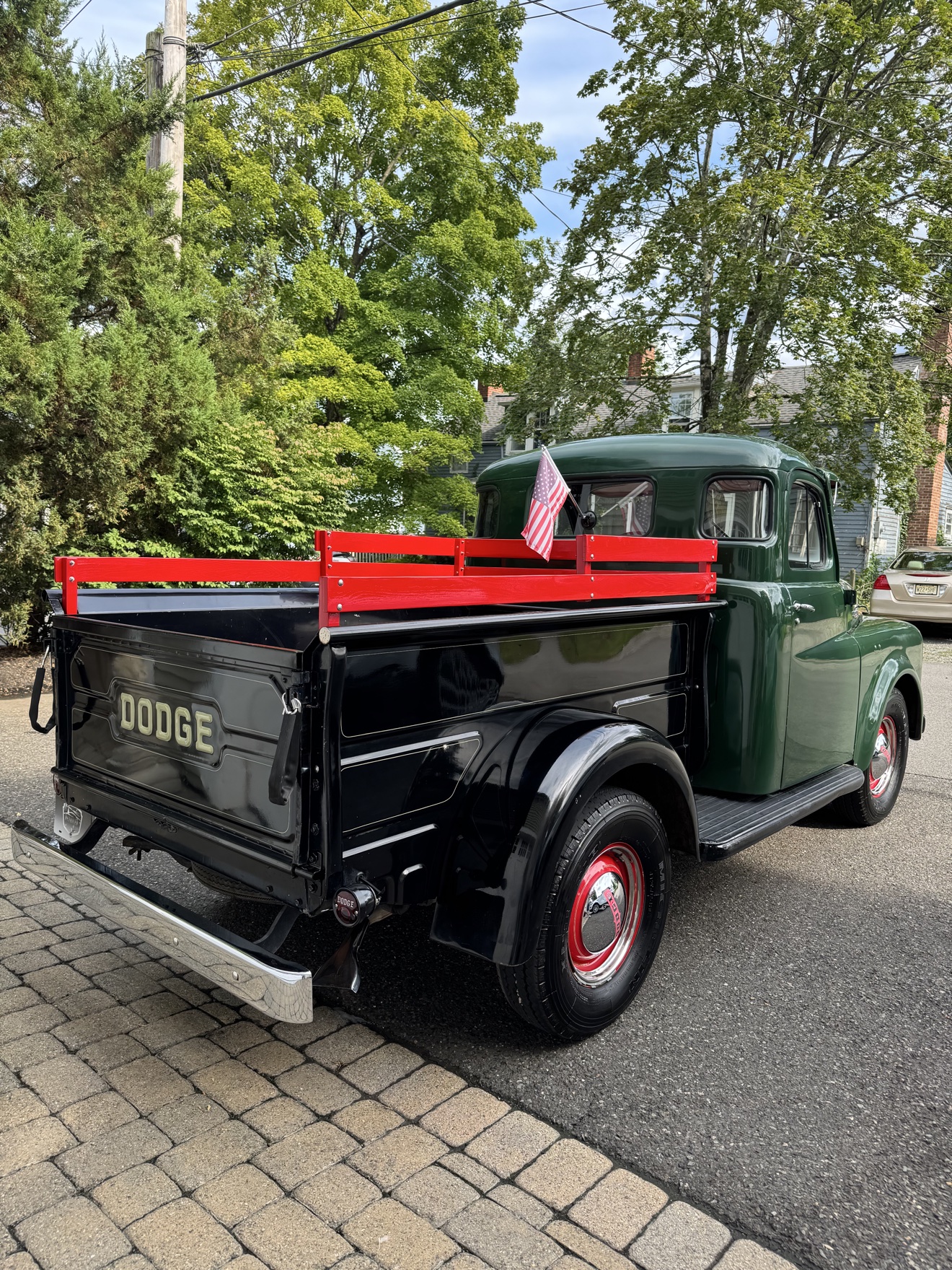 Green vintage Dodge B-Series “Pilothouse” Pickup rear three-quarter view with DODGE tailgate lettering