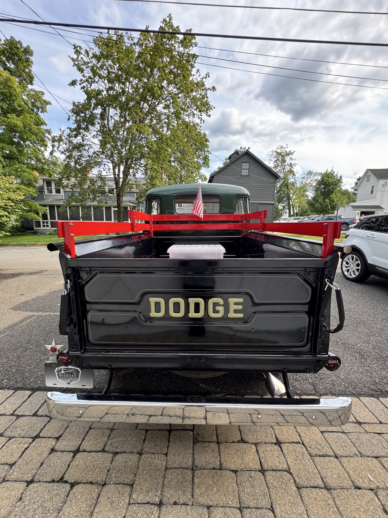 Rear view of a green vintage Dodge B-Series “Pilothouse” Pickup with DODGE tailgate lettering