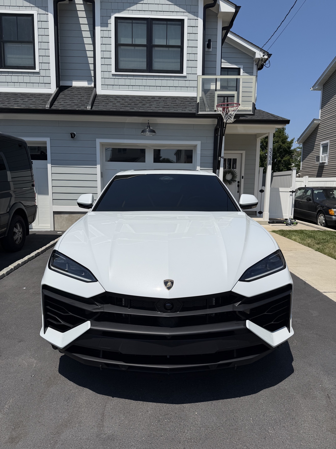 White Lamborghini Urus front view after detailing