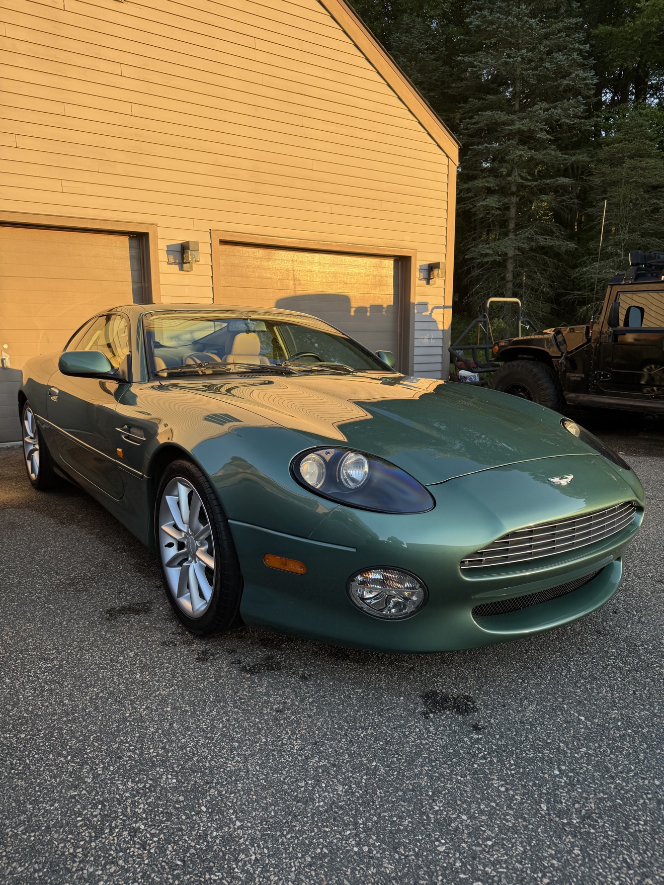 Green Aston Martin DB7 Vantage front three-quarter view after detailing