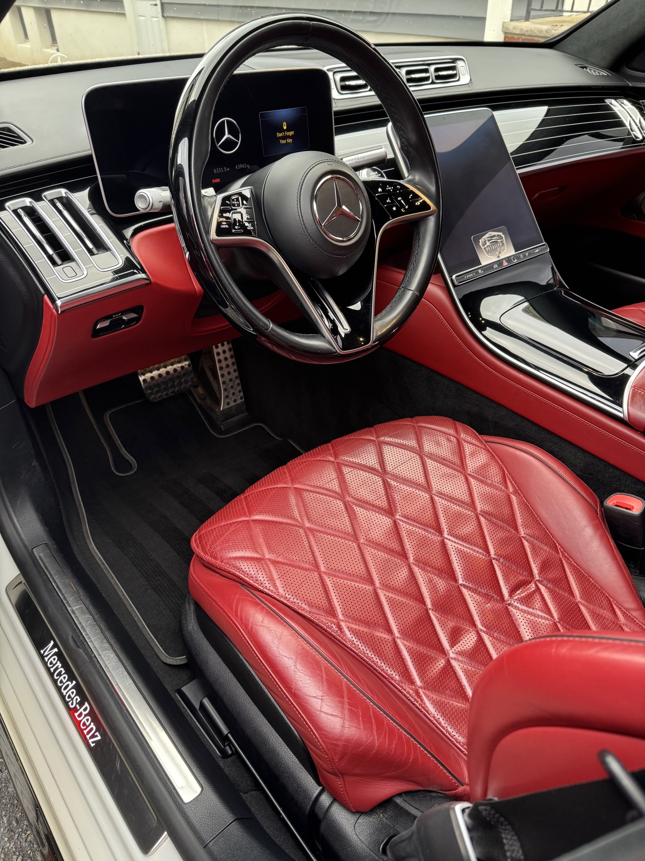 Mercedes-Benz S580 driver cockpit with red quilted leather interior