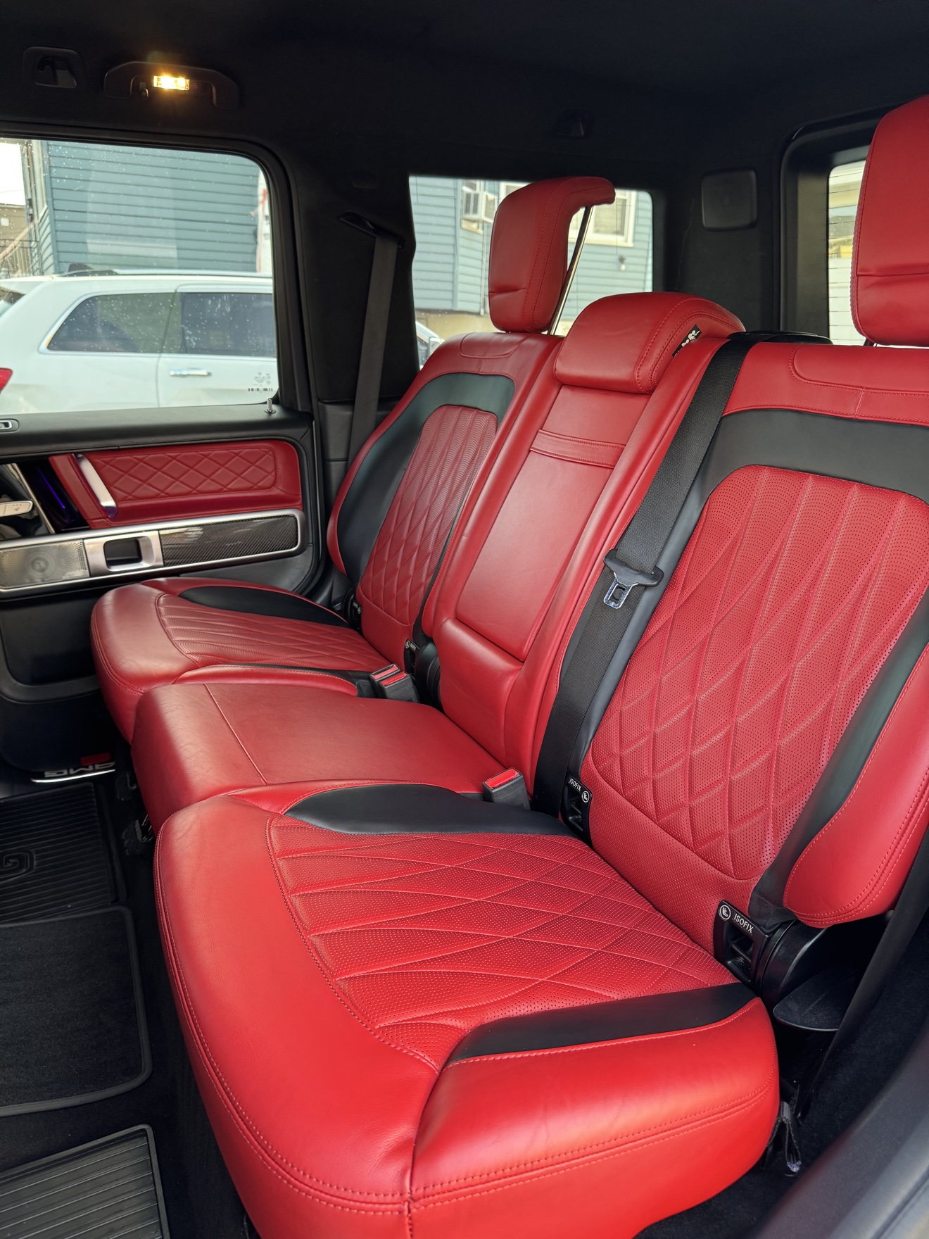 Red leather rear seats in the G-Wagon after detailing