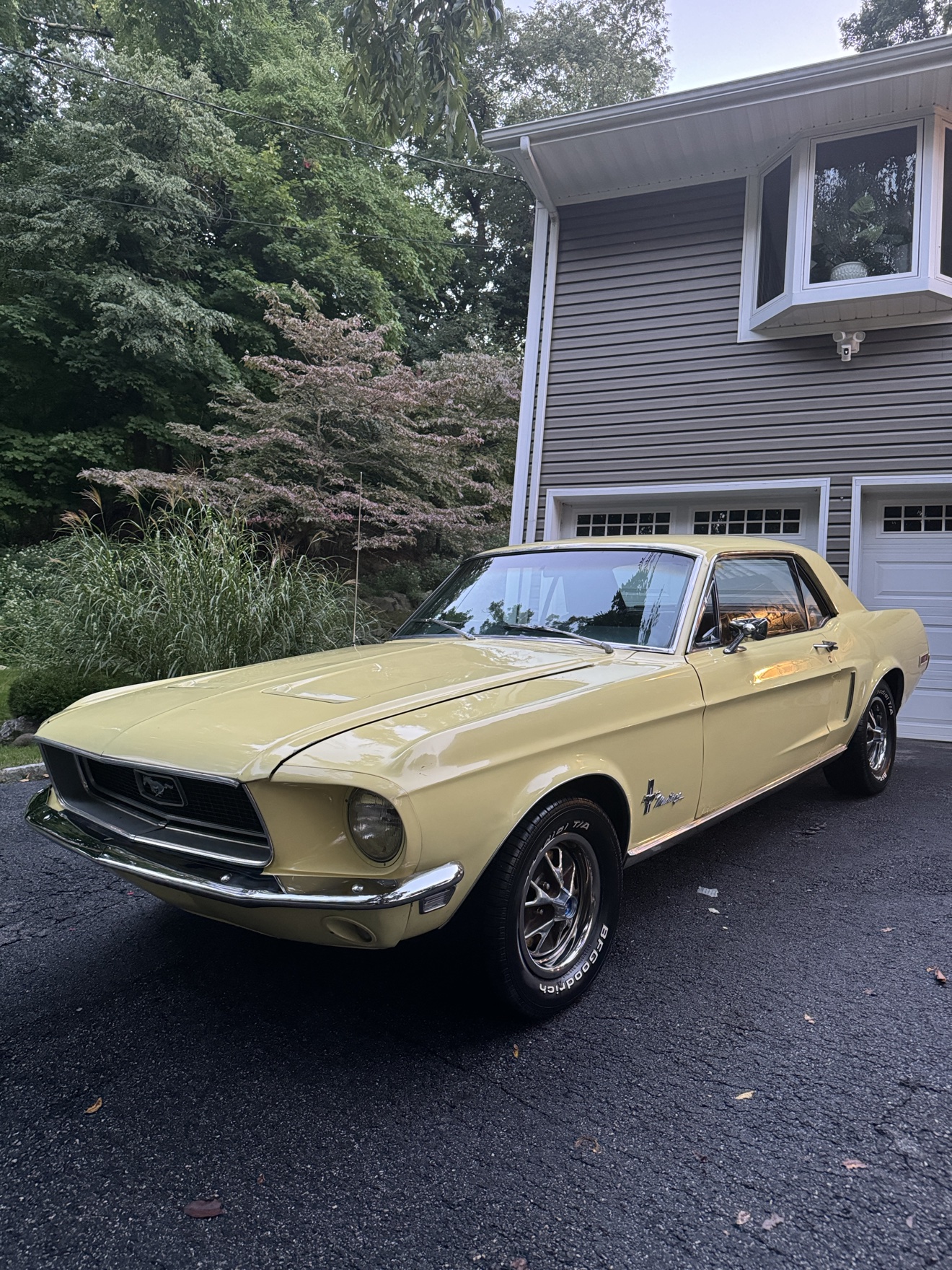 Pale yellow 1968 Ford Mustang front three-quarter view after detailing